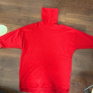 Red sweater that can be worn as a dress or shirt.